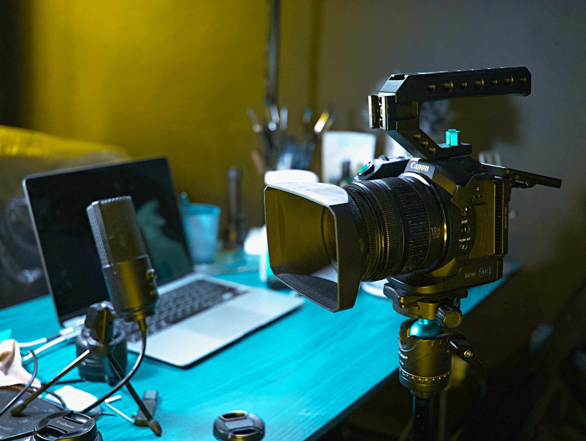 An editor's desk with a cinema camera and grading monitor